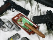 Gun and Cigars – Lets Strike a Match Up